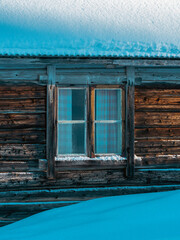 Window of an old summer farm farmhouse up in the Totenaasen Hills, Norway.