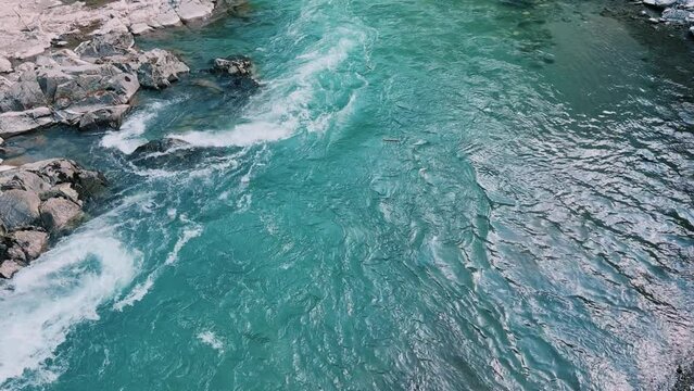 The Bolshaya Laba River. A mountain emerald river in a narrow, sunlit canyon. Bolshaya Laba River near the village of Psemen in Karachay-Cherkessia, Russia. Panoramic view. 4K