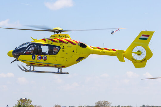 Fert&ouml;szentmiklos, Hungary - April 30, 2023: Rescue helicopter H135 of OMSZ L&eacute;giment&otilde;, Hungarian Air Ambulance coming in for landing