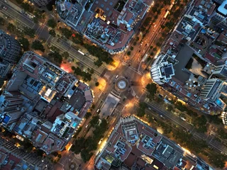 Poster Central areas of Barcelona at night. Top view, filming from a drone. © alzay