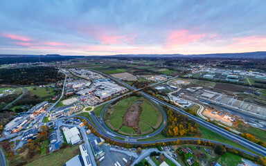 Lieboch, Austria - Highway exit and commercial area, aerial view - obrazy, fototapety, plakaty