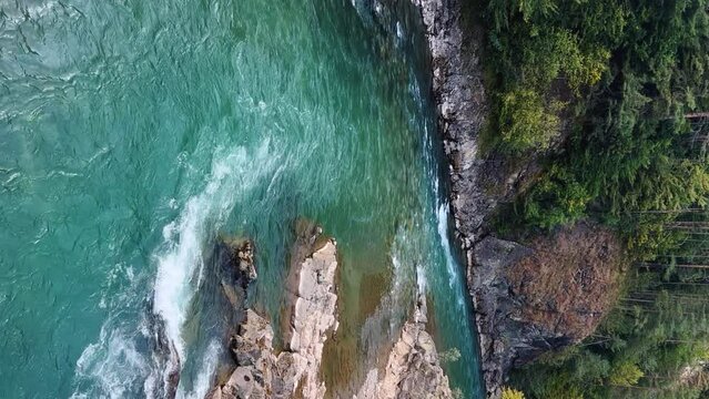 The Bolshaya Laba River. A mountain emerald river in a narrow, sunlit canyon. Bolshaya Laba River near the village of Psemen in Karachay-Cherkessia, Russia. Panoramic view. 4K