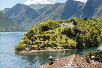 View of the Comacina Island with Saint Giovanni church on lake Como, Ossuccio, Lombardy, Italy