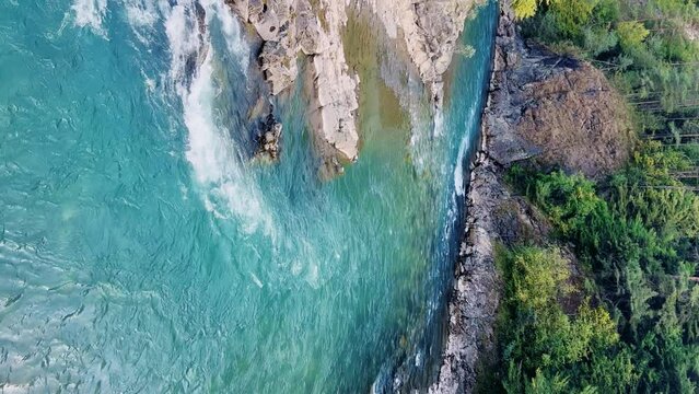 The Bolshaya Laba River. A mountain emerald river in a narrow, sunlit canyon. Bolshaya Laba River near the village of Psemen in Karachay-Cherkessia, Russia. Panoramic view. 4K