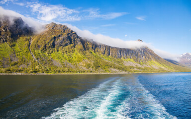 Cruising on the ferry in the Grillefjord from Senja to Lofoten in Norway, surrounded by a great scenery