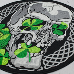 Embroidered patch skull with clover. Accessory for rockers, metalheads, punks, goths