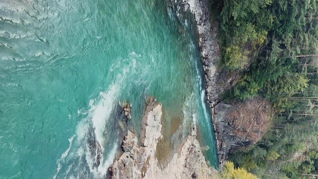 The Bolshaya Laba River. A mountain emerald river in a narrow, sunlit canyon. Bolshaya Laba River near the village of Psemen in Karachay-Cherkessia, Russia. Panoramic view. 4K