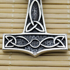 Silver Mjolnir pendant. Peruns ax. Pagan Style. Ancient amulet of Vikings and Slavs. A symbol of strength and power. Protection from evil spirits. Skull, ram's head. Kolovrat. Asatru.