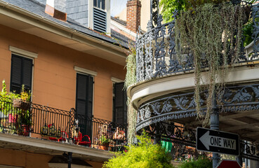 Hanging baskets on tradional New Orleans building on Royal Street in the French Quarter with grey...