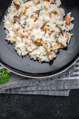 rice seafood risotto fresh eating cooking appetizer meal food snack on the table copy space food background rustic top view Pescetarian diet