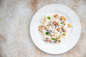 rice seafood risotto fresh eating cooking appetizer meal food snack on the table copy space food background rustic top view Pescetarian diet