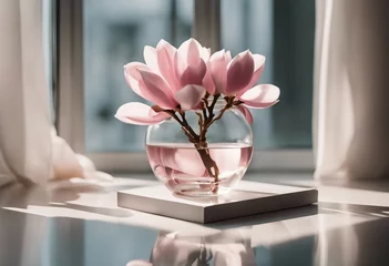 Rolgordijnen Beautiful pink magnolia flower in transparent glass vase standing on white table sunlight on pastel table © FrameFinesse
