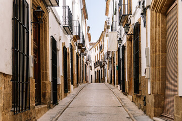 Fototapeta premium A quaint cobbled street of historic buildings in the old town of Javea, Valencia, Spain.