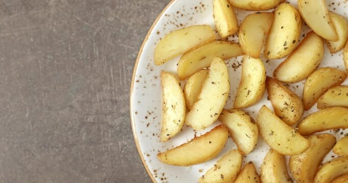 Fried potatoes on a plate, copy space