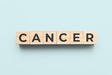 cancer wooden cubes on blue background