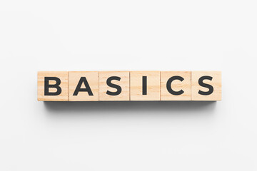Basics wooden cubes on grey background