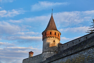 Fototapeta na wymiar The part of Old Kamianets-Podilskyi Castle under a cloudy grey sky.