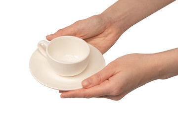 Female hand holding coffee cup and saucer isolated on white background.