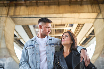 a stylish young couple captures the essence of their love against the backdrop of urban life.