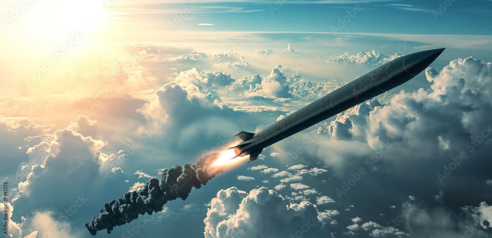 Poster Hypersonic missile. A combat rocket is flying above the clouds. Missile attack, air attack, war, missile strike.