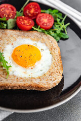 Fototapeta na wymiar toast fried egg bread scrambled yolk protein breakfast food fresh eating cooking appetizer meal food snack on the table copy space food background rustic top view