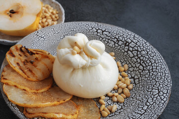 Italian burrata cheese. Burrata served with marinated pear, pine nuts and caramel sauce. Cafe menu....