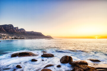 Cape Town Sunset over Camps Bay Beach with Table Mountain and Twelve Apostles in the Background