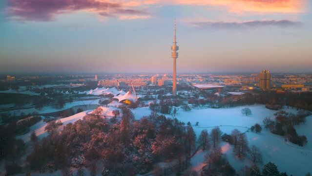 Munich city skyline aerial view drone footage of city munich germany fly over olmpiy park in front munich tv tower munich winter with snow germany.