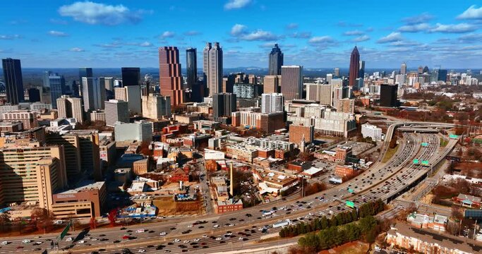 Scenic daytime view of huge metropolis downtown with heavy traffic. Panorama of Atlanta, Georgia, USA from top.