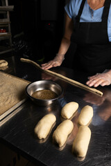 women's hands in the bakery prepare pastries
