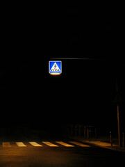 Illuminated crosswalk at night