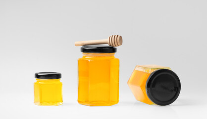 Honey in jars on a white background close-up.