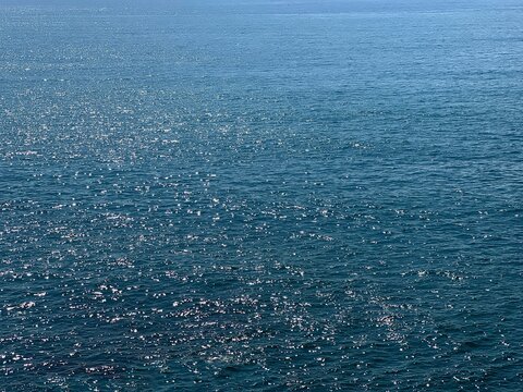 Blue sea glittering water surface