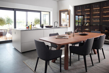 Modern dining room in minimal style with wooden furniture, 3d rendering