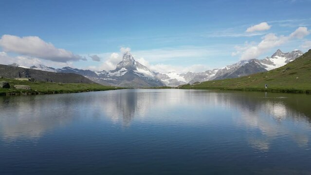 Majestic mountain peak reflected in serene Stellisee lake with Matterhorn mountain