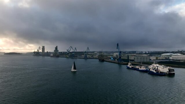 Gloomy skies over Lorient's bustling port.
