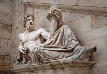 The ancient statue of Tiberinus (god of the river Tiber) holding a cornucopia (the horn of plenty). It lies in front of Palazzo Senatorio, in Piazza del Campidoglio (Capitoline square), in Rome, Italy