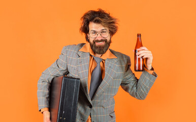 Bearded man in glasses with bottle of beer. Drunk businessman in suit and necktie with briefcase...