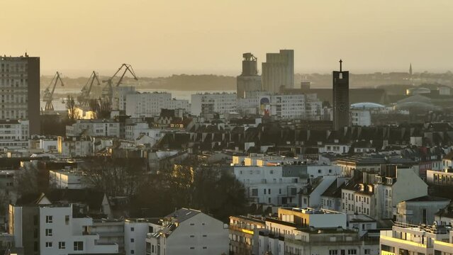 Sunset glow over Lorient's urban skyline.