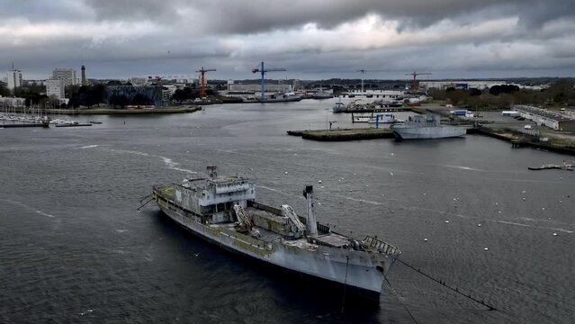 Dilapidated ship awaits fate in Lorient harbor.