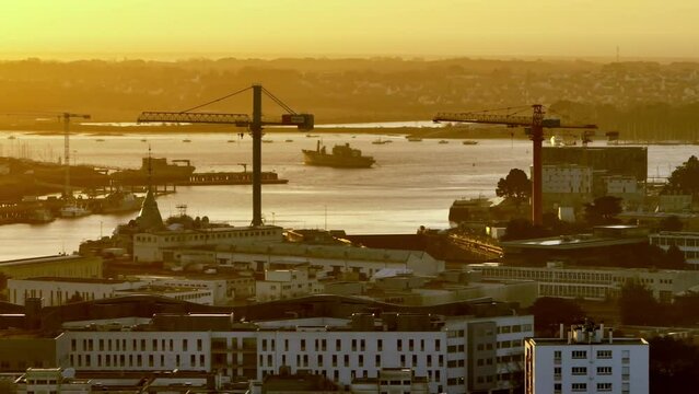 Golden hour casts warmth on Lorient city.