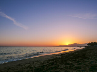 Fototapeta na wymiar Golden Sunset Over Peaceful Beach Shore