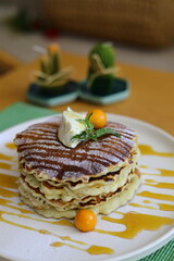 Healthy summer morning breakfast pancakes with fresh berry. Stack of traditional pancakes with blueberry, raspberries, honey.