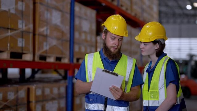 operation workers checking and inspecting cargo for stack items for shipping. males worker checking the store factory. industry factory warehouse. Worker Scanning Package In Warehouse.