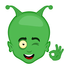 vector illustration head alien or extraterrestrial cartoon winking eye and with his hand making an ok or perfect gesture