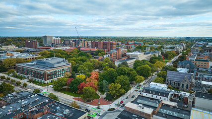 Fototapeta premium Aerial Autumn Urban Landscape with American Flag, Ann Arbor University Campus