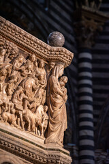 SIENA, ITALY - SEPTEMBER 23, 2023 - Mother mary with child at the marble pulpit in the Siena cathedral, designed by Niccolo Pisano - obrazy, fototapety, plakaty