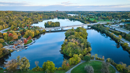 Fototapeta na wymiar Aerial Autumn Riverside with Bridge and Marina in Michigan