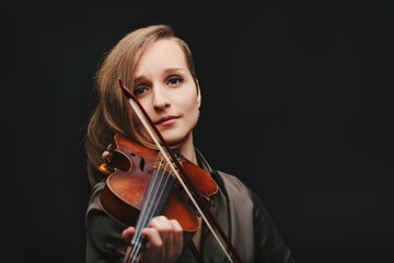 Passionate young violinist immersed in her music
