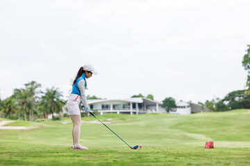 Professional woman golfer practice in golf course